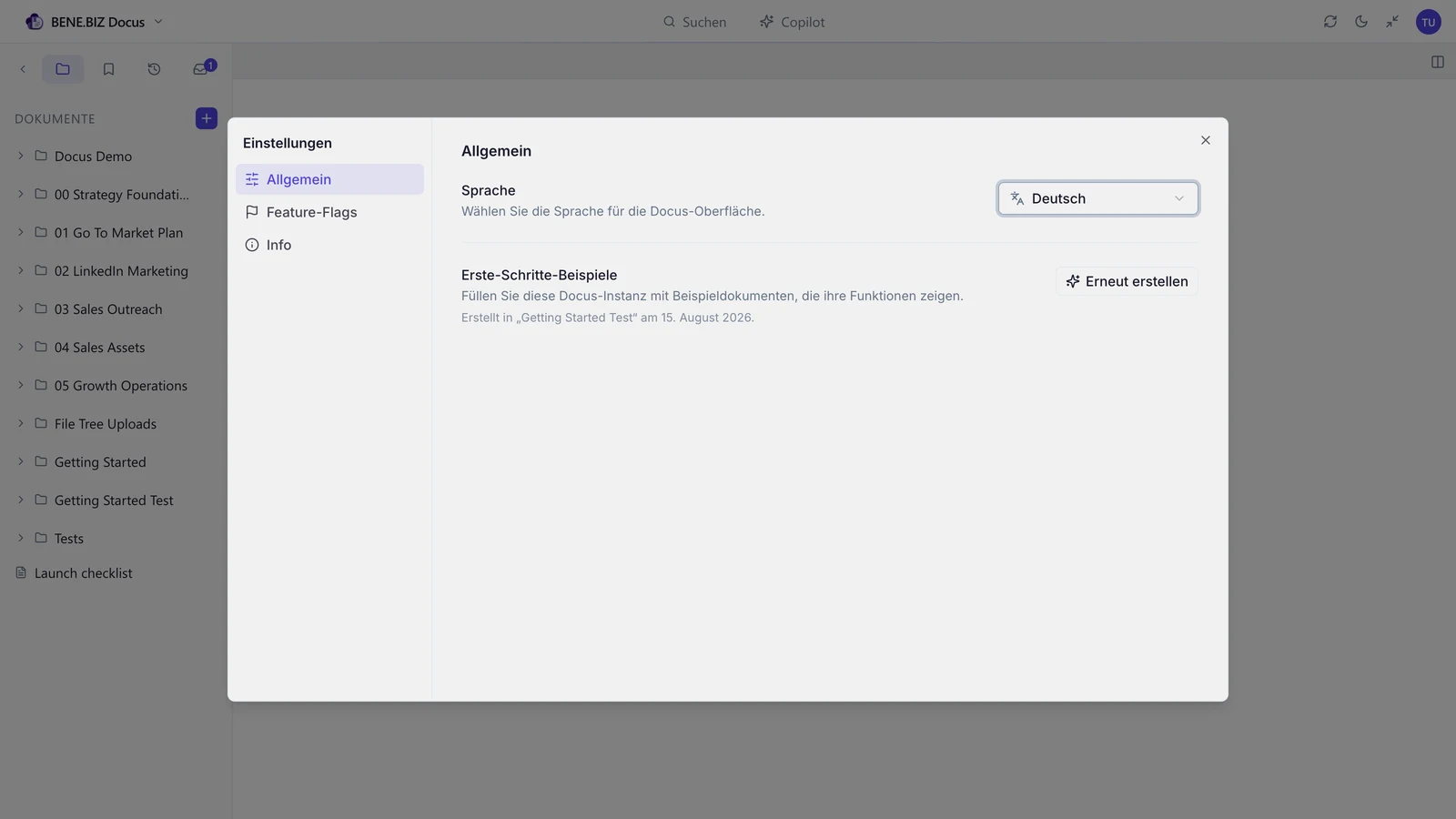 The Docus interface switched to German in Settings, with the language picker open